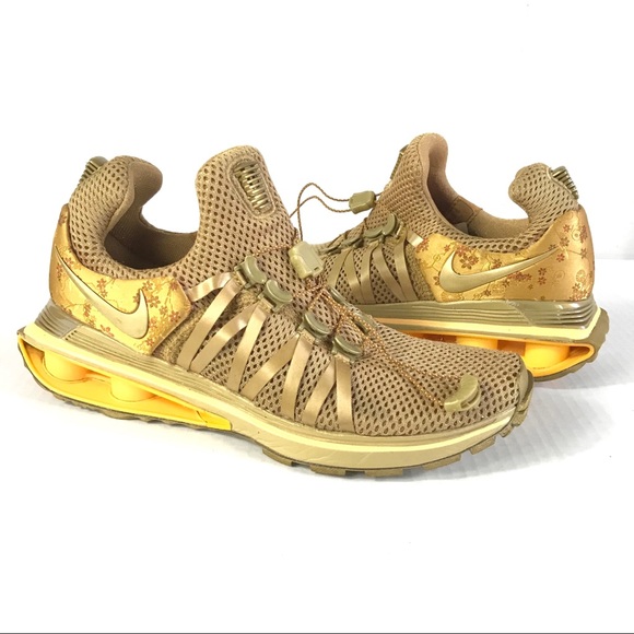 nike shox gravity metallic gold women's shoe